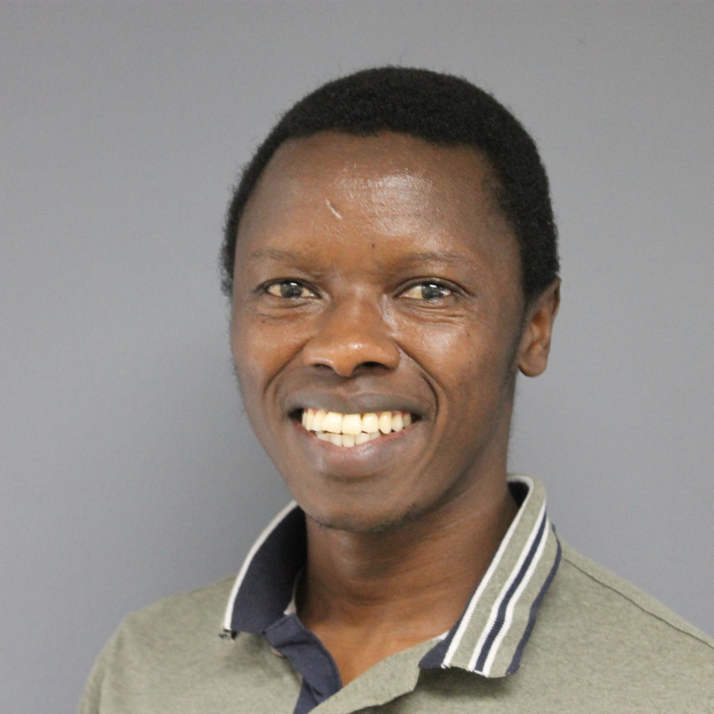 picture of a smiling man on a grey background