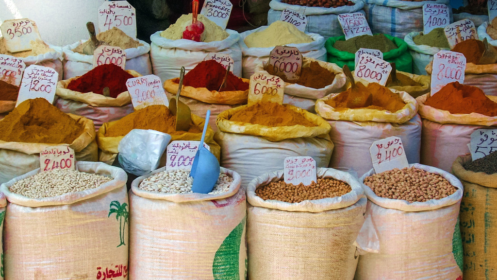 Sacks of beans and spices in a market.