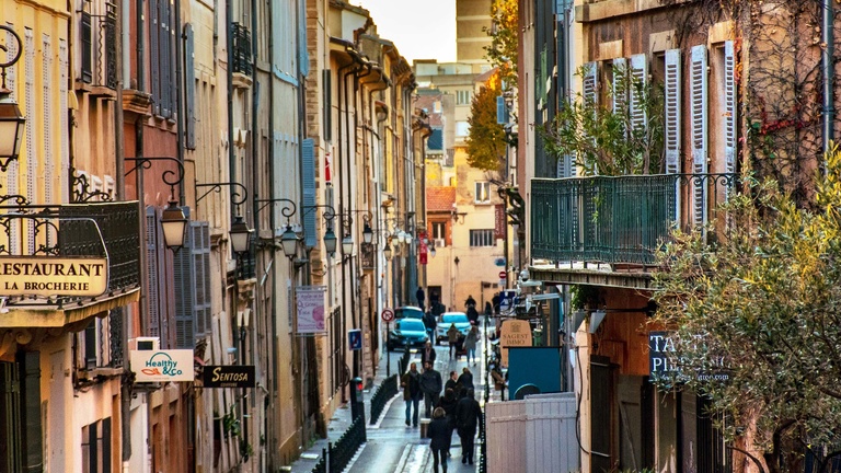 The busy street life of a French town.